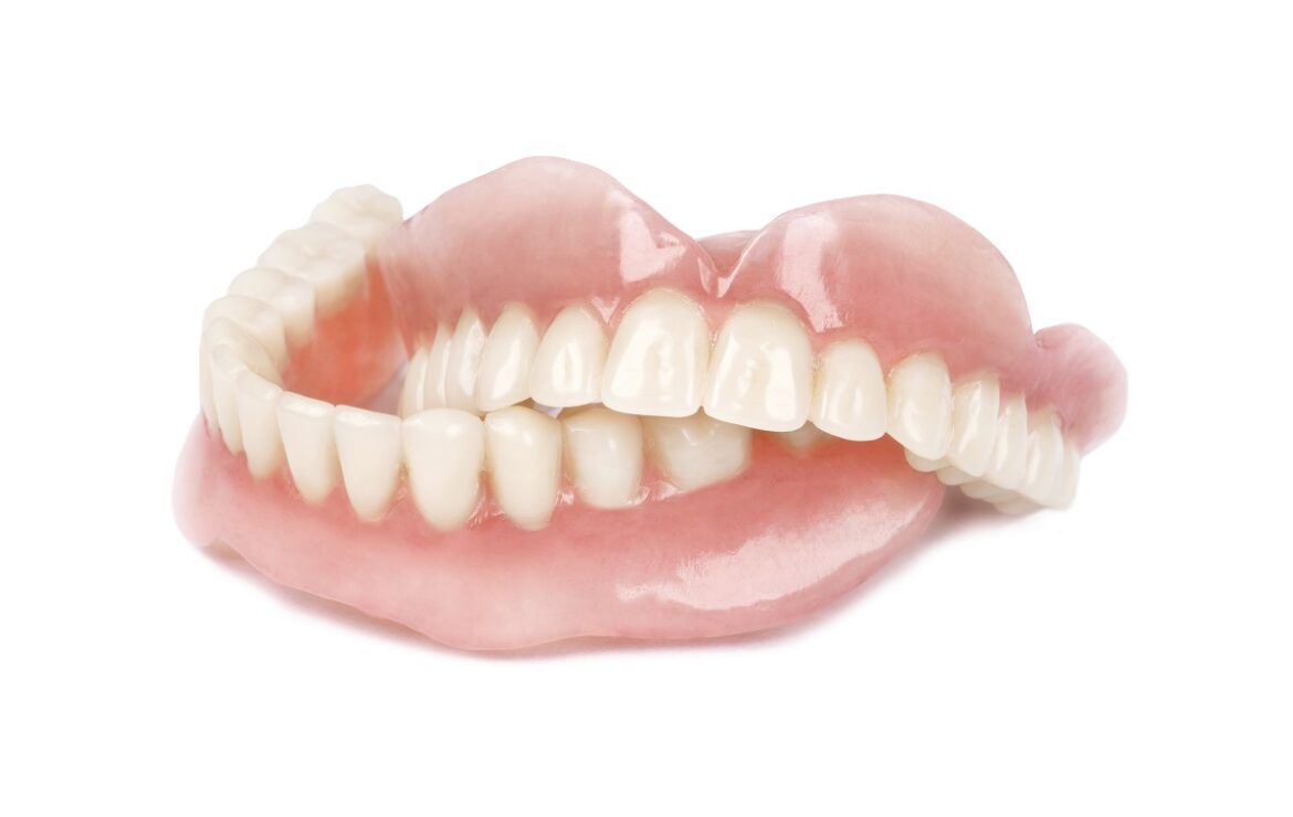 Dentures Vs Implants: Pros and Cons